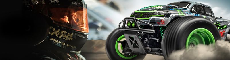 1/10 Savage XS Flux VG Jnr radio control truck with geometric livery, 4WD, powerful brushless motor, and water-resistant features.