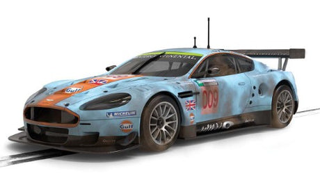 Gulf Aston Martin DBR9 Weathered slot car replica, showcasing realistic detailing and historic racing livery.