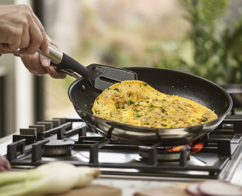 Joseph Joseph Elevate Silicone Slotted Turner with heat-resistant head and stainless-steel handle, ideal for flipping and serving.