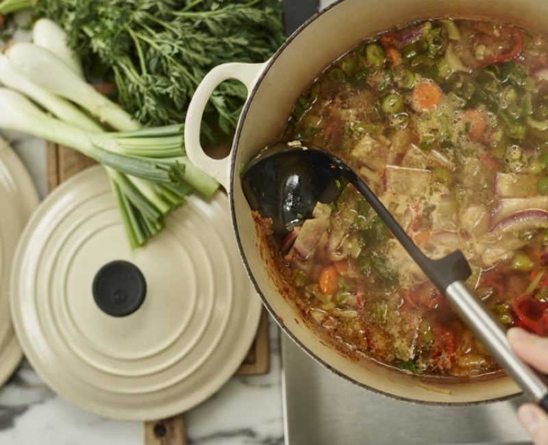 Joseph Joseph Elevate Silicone Ladle with sleek stainless-steel handle, deep silicone head, and integrated tool rest for mess-free cooking.