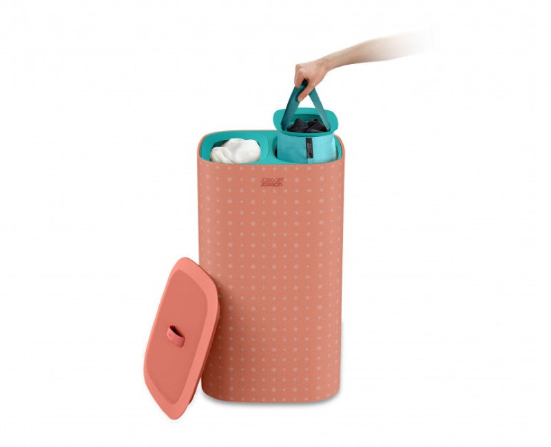 Joseph Joseph Tota Pop 60L laundry basket in coral with tri-bag system for easy sorting of light, dark, and colored fabrics.