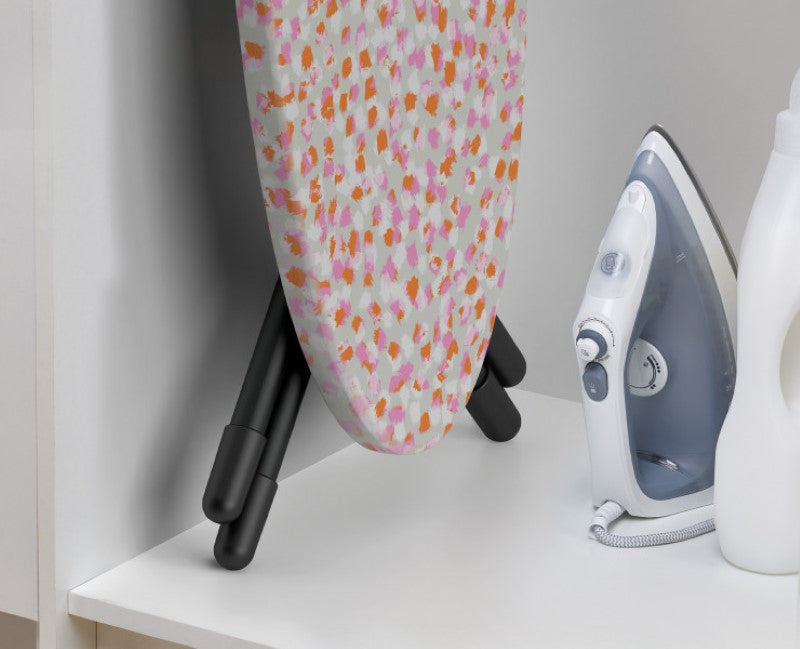 Joseph Joseph Glide Easy-store Ironing Board features a compact design, ergonomic handle, and adjustable height for seamless ironing.
