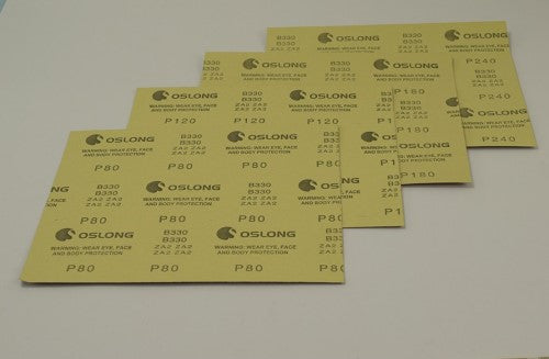 Set of four thick sandpaper sheets (80-240 grit) for precise sanding of wood, plastic, and cardboard in modeling projects.