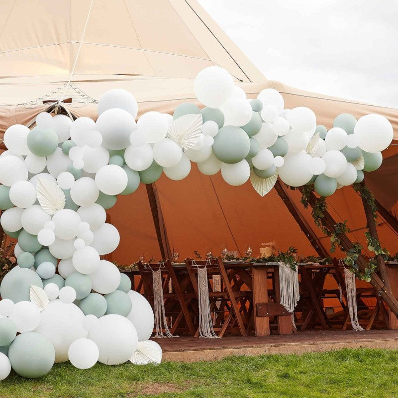 Luxe sage and white balloon arch with paper fans, featuring 200 high-quality balloons for chic event decorations.