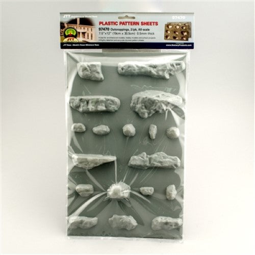 Two realistic model rock outcroppings for enhancing hobby dioramas and layouts with intricate textures and natural details.