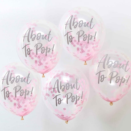 Pack of 5 pastel pink 'About To Pop' confetti balloons for baby showers, durable and festive, measuring 30cm.
