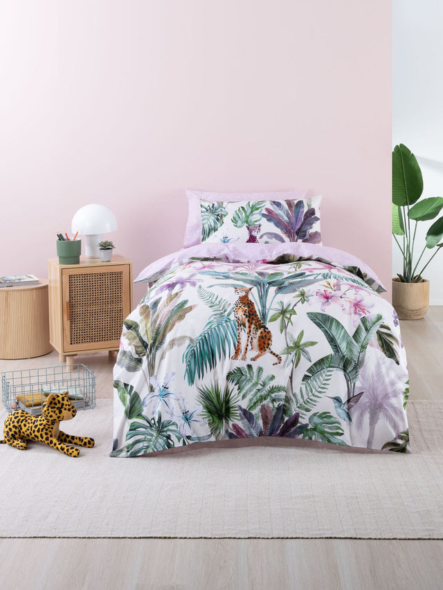 Double duvet cover set featuring playful cheetahs in a jungle scene with purple and green accents on a vanilla base.