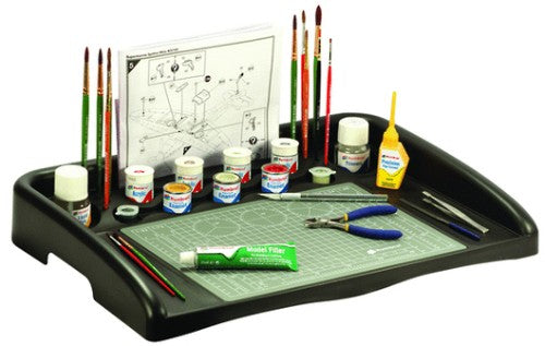 Durable Humbrol Work Station for modelers, resistant to Poly Cement, keeps materials organized and secure.