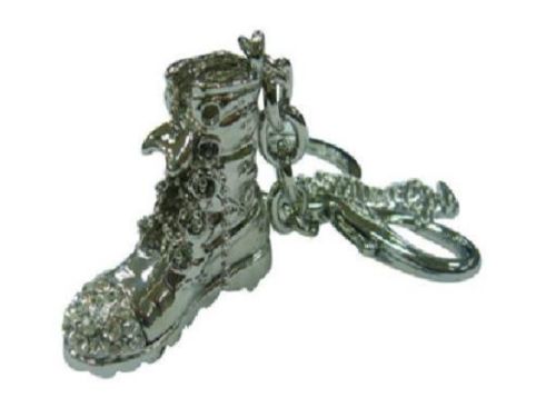Stylish silver boot keyring adorned with bling, perfect for keys or bags, blending fashion and functionality.