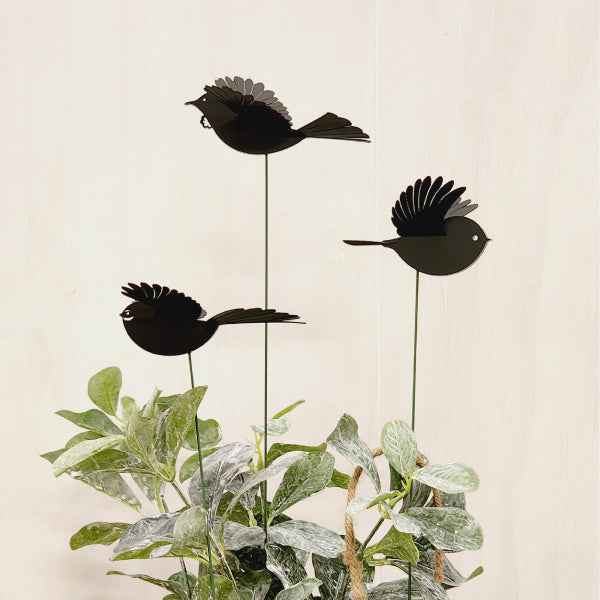 Mini Fantail Plant Stake in laser-cut acrylic, featuring whimsical wings, perfect for enhancing gardens and indoor plants.