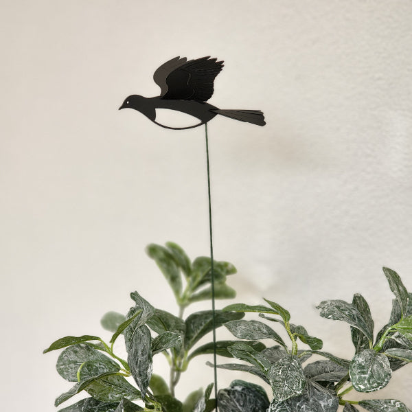 Mini Kereru plant stake featuring 3D polypropylene wings, 40cm tall, enhances gardens and potted plants with whimsical charm.