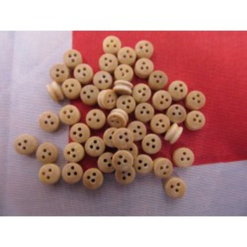 Set of 50 wooden dead eyes, each 5mm, perfect for rigging model ships with durability and aesthetic appeal.