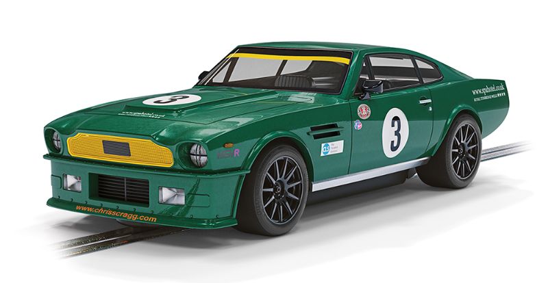 Scalextric Aston Martin V8 #3 in classic green and yellow, featuring sidewinder chassis and detailed interior for racing.