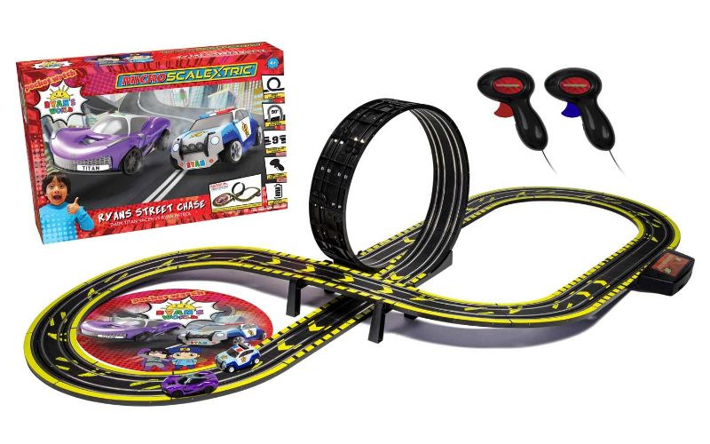 Scalextric M Set Bat features Ryan's Patrol Car chasing Dark Titan, includes loop track and 9 racing layouts for kids.