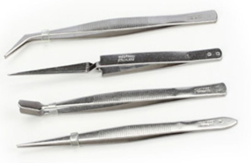 4-piece tweezer set in a pouch, including self-closing, slanted, pointed, and flat tweezers for precise hobby work.