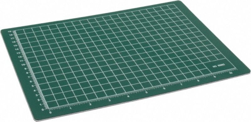Green self-healing cutting mat, 12x18 inches, with a grid pattern for precise cutting and protection for work surfaces.
