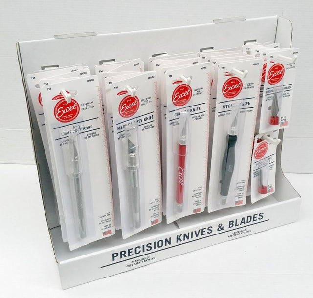 Display of various Excel knives and blades for hobbyists and professionals in a retail setting, emphasizing safety and accessibility.