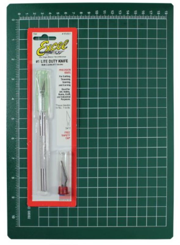 Excel Blades Precision Cutting Kit with K1 knife, 5 #11 blades, and 8.5" x 12" cutting mat featuring a grid pattern.