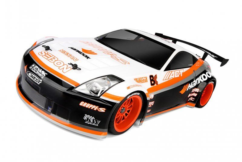 Clear 200mm Nissan 350Z Hankook RC body shell with decals for custom painting, fits 1/10 touring cars and includes wing.