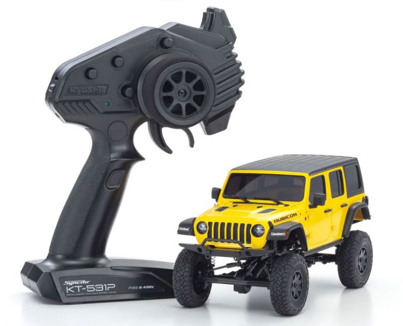 Kyosho MX-01 Wrangler Unlimited Yellow mini RC crawler with 4x4 chassis and detailed Jeep design for rugged adventures.