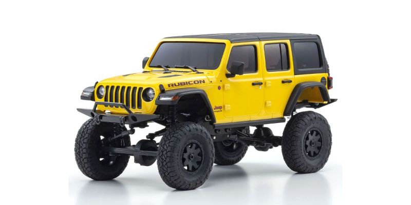 Kyosho MX-01 Wrangler Unlimited Yellow RC car with detailed design and 4x4 chassis for adventurous off-road crawling.
