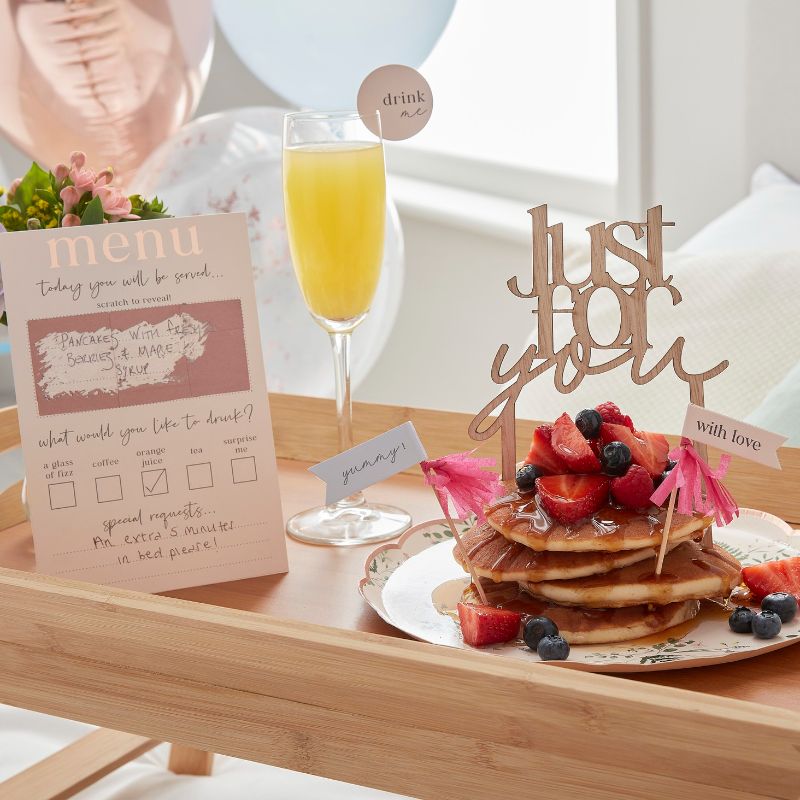 Customisable Breakfast in Bed Set featuring a scratch-to-reveal menu and charming decorative toppers for a delightful morning surprise.