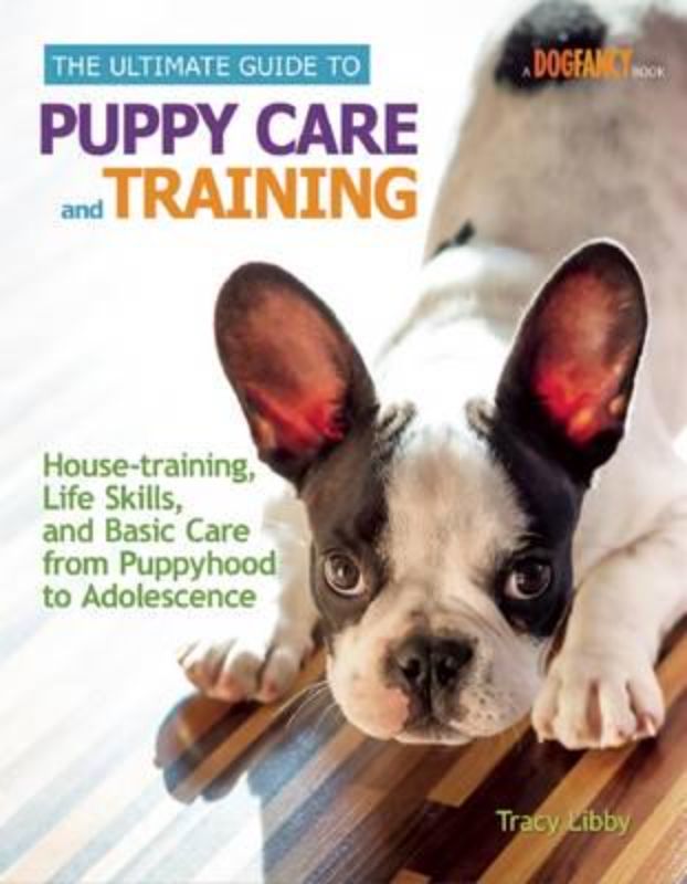 Comprehensive hardback guide by Tracy Libby on puppy care and training, featuring tips for first-time and seasoned dog owners.