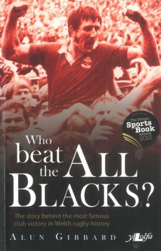 A paperback book recounting Llanelli's historic 1972 victory over the All Blacks, featuring key personalities and match details.