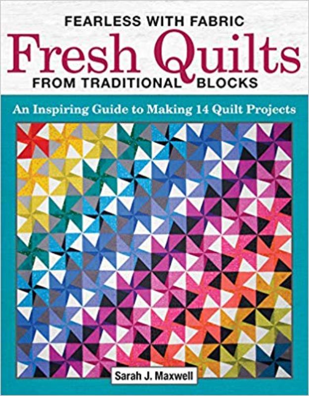 Project book 'Fearless With Fabric' by Sarah J. Maxwell, offering 14 innovative quilting projects and creative guidance.