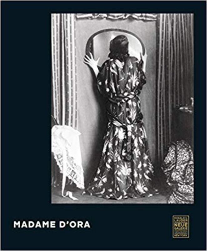 Hardback book titled 'Madame D'ora' featuring iconic 20th-century photography by Dora Kallmus, capturing art and society.