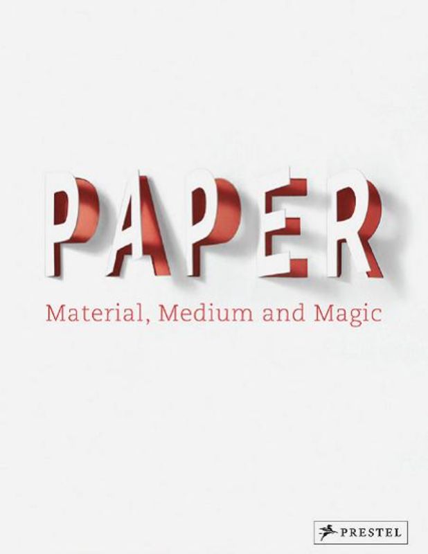 Hardcover book 'Medium and Magic' showcasing the art and history of paper with 272 illustrated pages by Neil Holt and Nicola Von Velsen.
