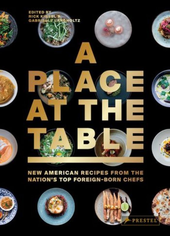Hardback cookbook showcasing recipes from 40 foreign-born chefs transforming America's culinary scene.