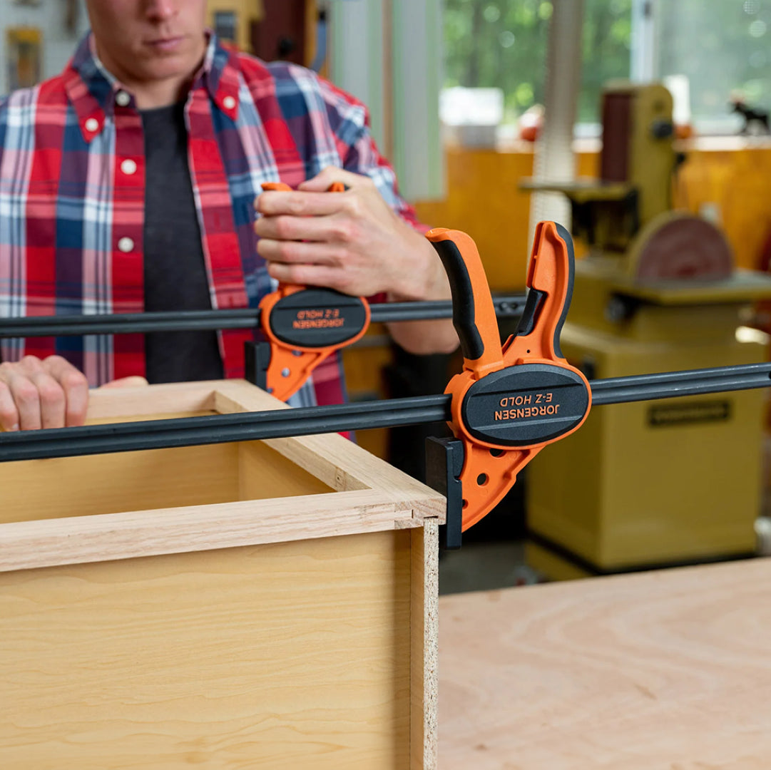 PONY JORGENSEN 900mm Medium-Duty E-Z HOLD Bar Clamp with one-handed operation and ergonomic grip for woodworking tasks.