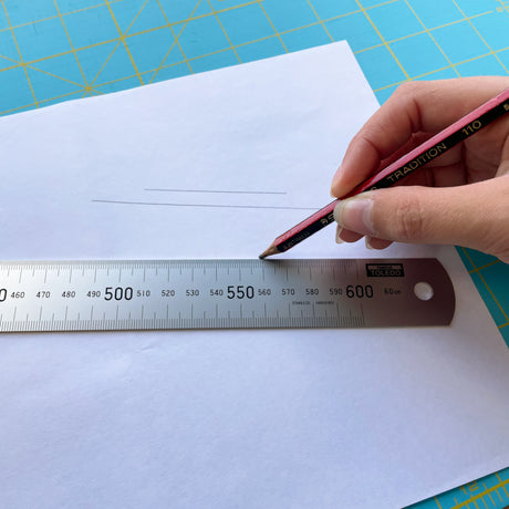 TOLEDO 600mm Stainless Steel Rule with dual metric and imperial measurements, crafted for precision and durability.