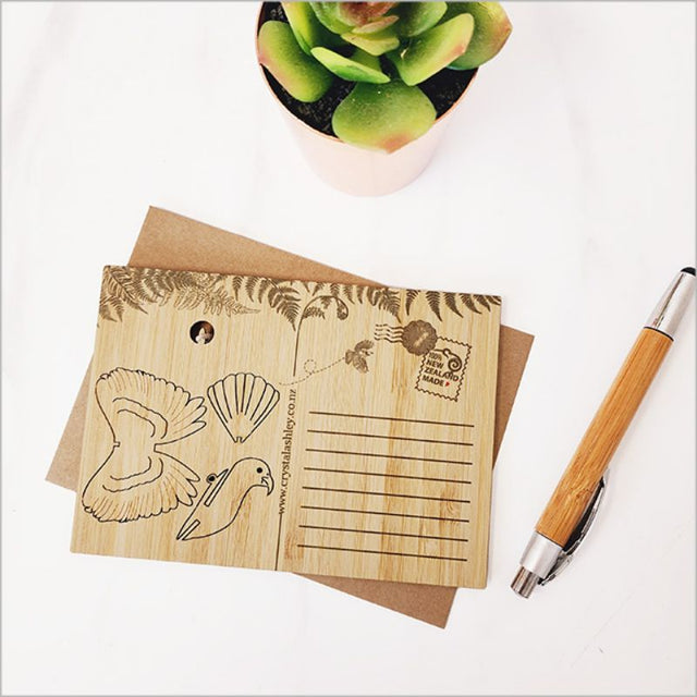 Bamboo postcard featuring a detachable Kea 3D ornament, eco-friendly and beautifully packaged with a craft envelope.