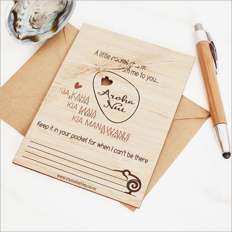 Eco-friendly bamboo postcard featuring Kia Kaha motif, perfect for messages and decorative hanging.