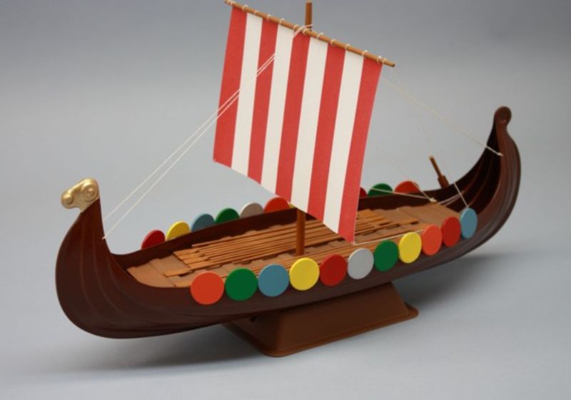 Detailed Wooden Viking Ship model kit with laser-cut parts, paper sails, and a display stand for collectors.