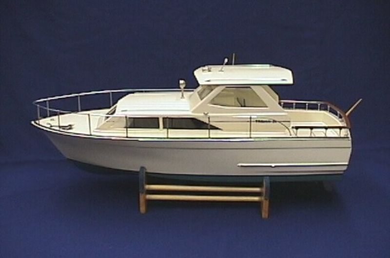 31-inch Wooden Ship Model Kit of the Trojan Cabin Cruiser, features detailed parts for a realistic nautical display.