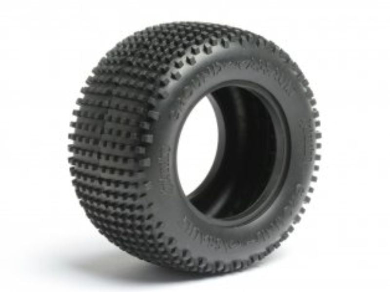Durable 1/10 ST T 2.2" Ground Assault tires with modern tread for superior grip on hard-packed surfaces.