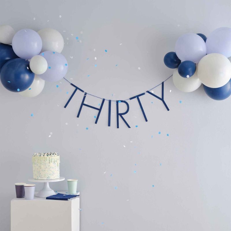 Navy and gold balloon bunting for a stylish 30th birthday celebration, perfect for indoor and outdoor decor.