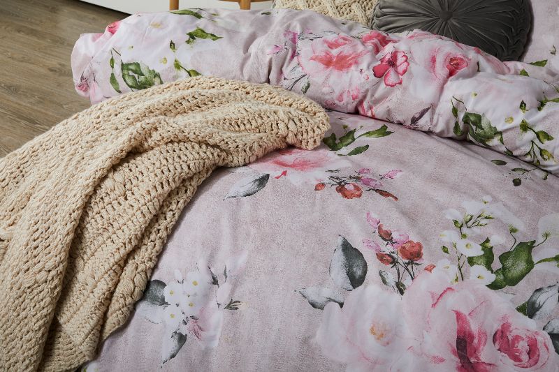 Cherub Pink duvet cover set featuring a botanical floral design with faux-linen texture, perfect for queen beds.