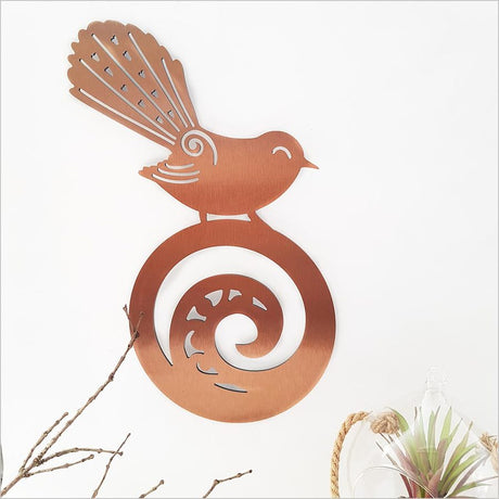 Kiwiana Wall Art featuring a Fantail on Koru, showcasing New Zealand's beauty in a durable, lightweight design.