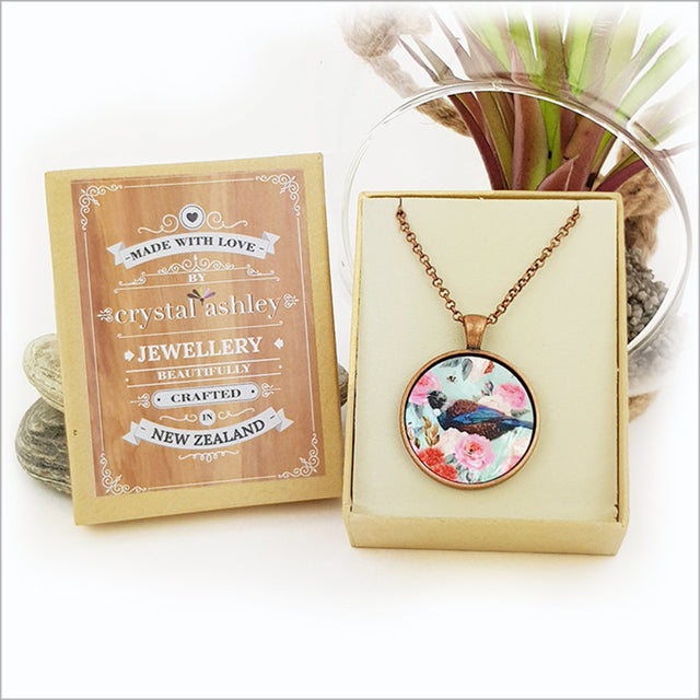 Elegant Circle Necklace featuring Floral Tui design on mother of pearl, with 30mm pendant and antique copper chain.