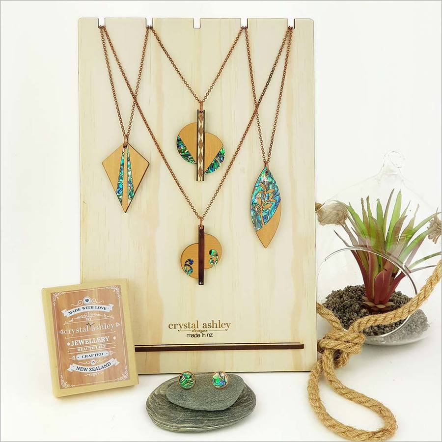 Rimu Necklace featuring a laser-cut leaf design inlaid with vibrant South Island Paua, on a 75cm chain.