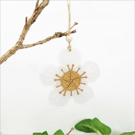Elegant Manuka Flower ornament crafted from bamboo and white satin acrylic, perfect for holiday decor and easy gifting.
