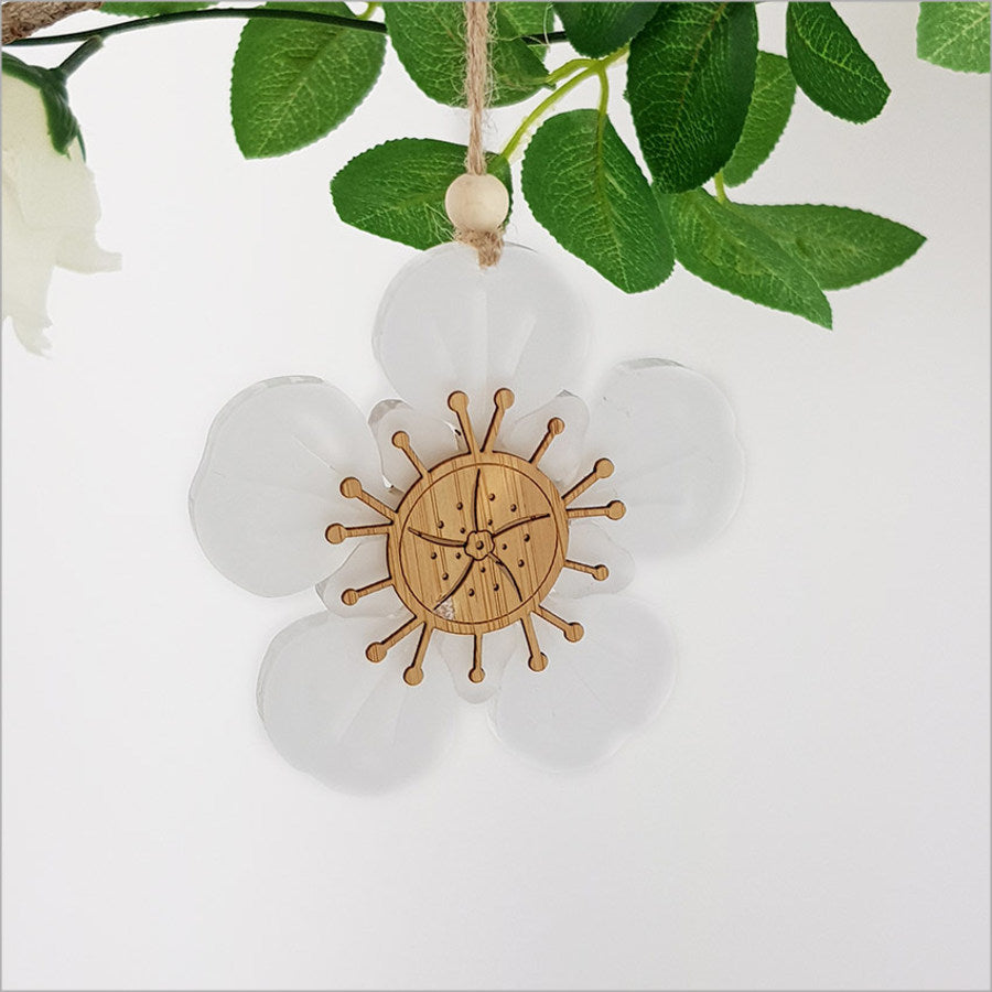Elegant Manuka Flower ornament in bamboo and white satin acrylic, perfect for holiday decor and gifting.