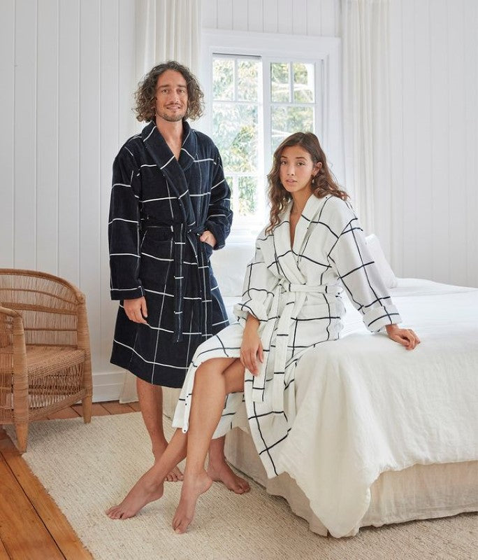 Luxurious white velour bathrobe with a check design, shawl collar, pockets, and waist tie, perfect for home comfort.