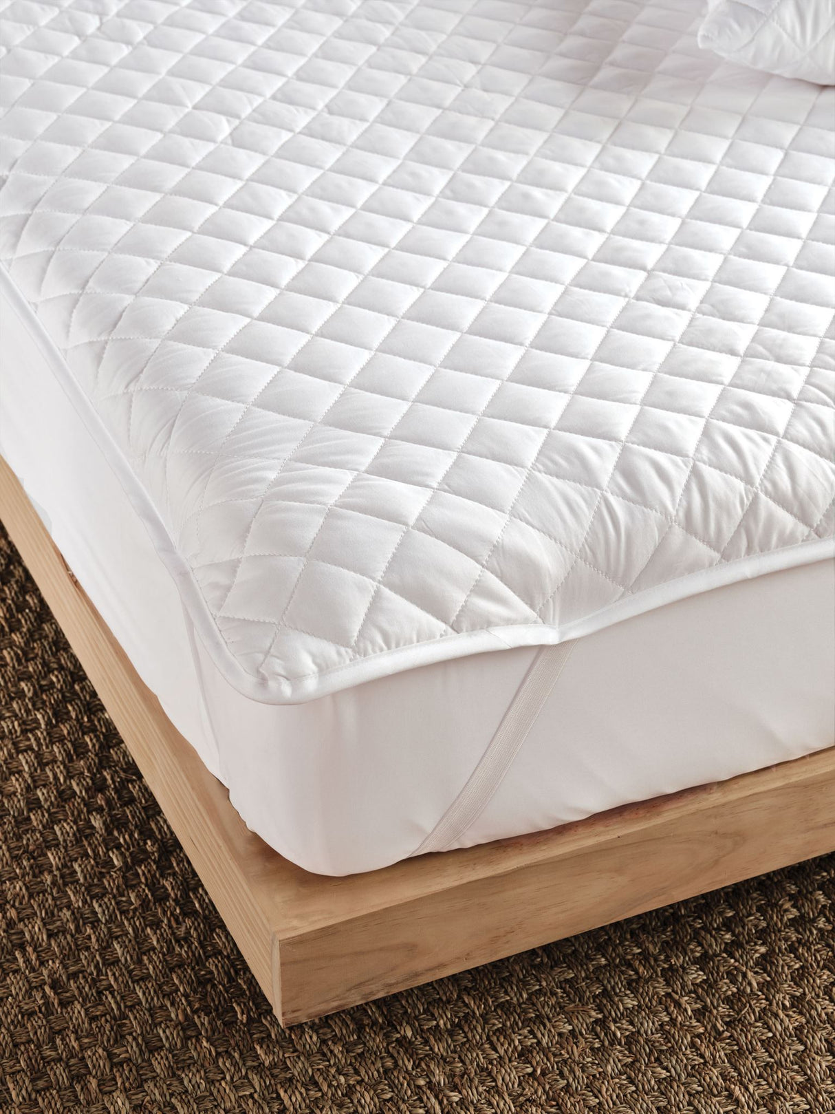 Comfy Super King mattress protector from Savona, featuring soft polyester fill for comfort and hypoallergenic microfibre cover.