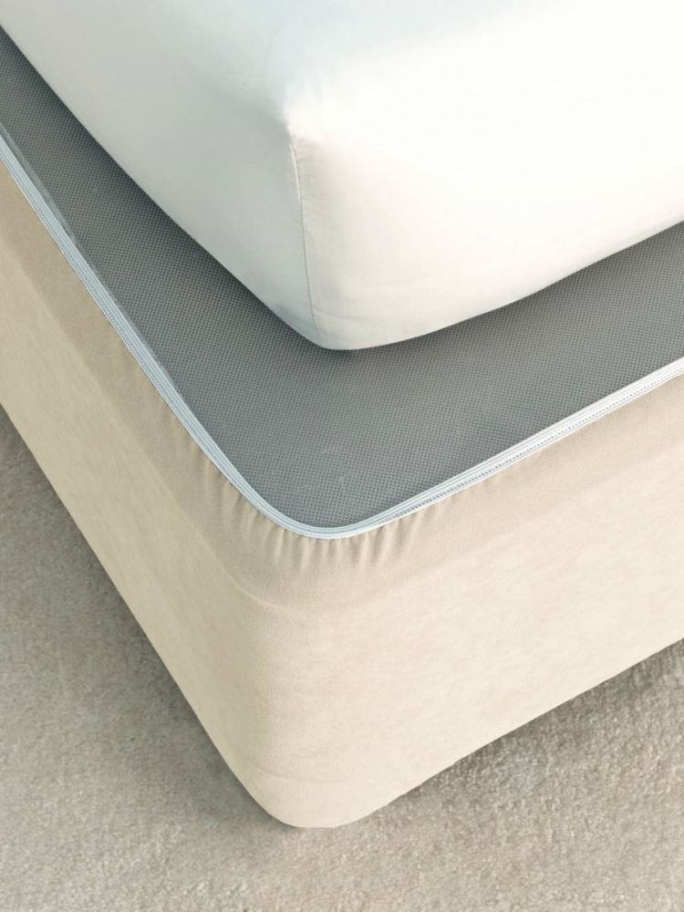 Cream faux suede single bed wrap with elasticized edges for a polished look without removing the mattress.