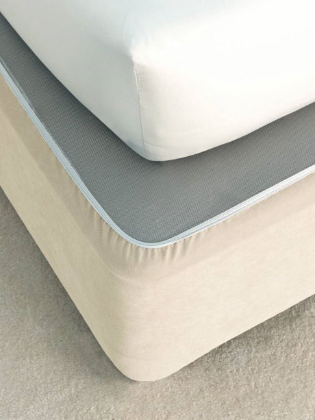 Cream faux suede single bed wrap with elasticized edges for a polished look without removing the mattress.